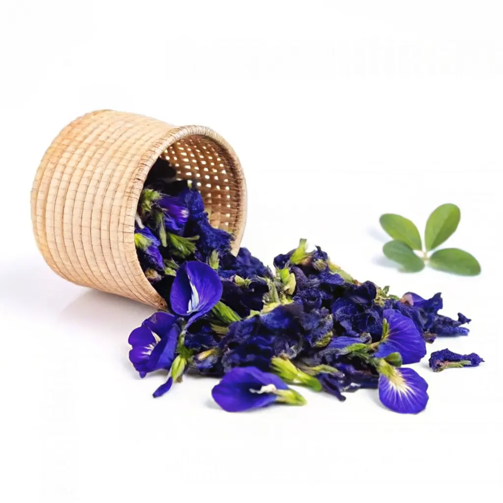 How to Make Butterfly Pea Flower Tea 6 Dried butterfly pea flowers spilling from a woven basket on a white background with green leaves.