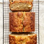 Freshly baked sliced cottage cheese banana bread cooling on a wire rack